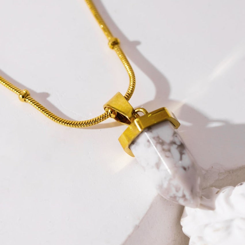 Style AMELIE 2330: White Turquoise Stone Pendant Anchored on a Beaded Snake Skin Textured Chain Necklace.