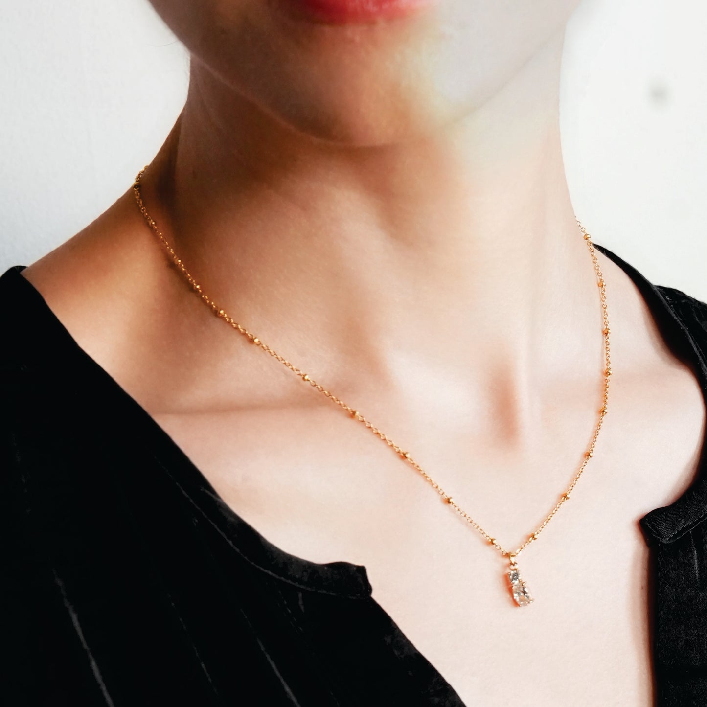 CABBANA Gold: A Duo Set of Zirconia Charm Pendants on a Beaded Chain Necklace