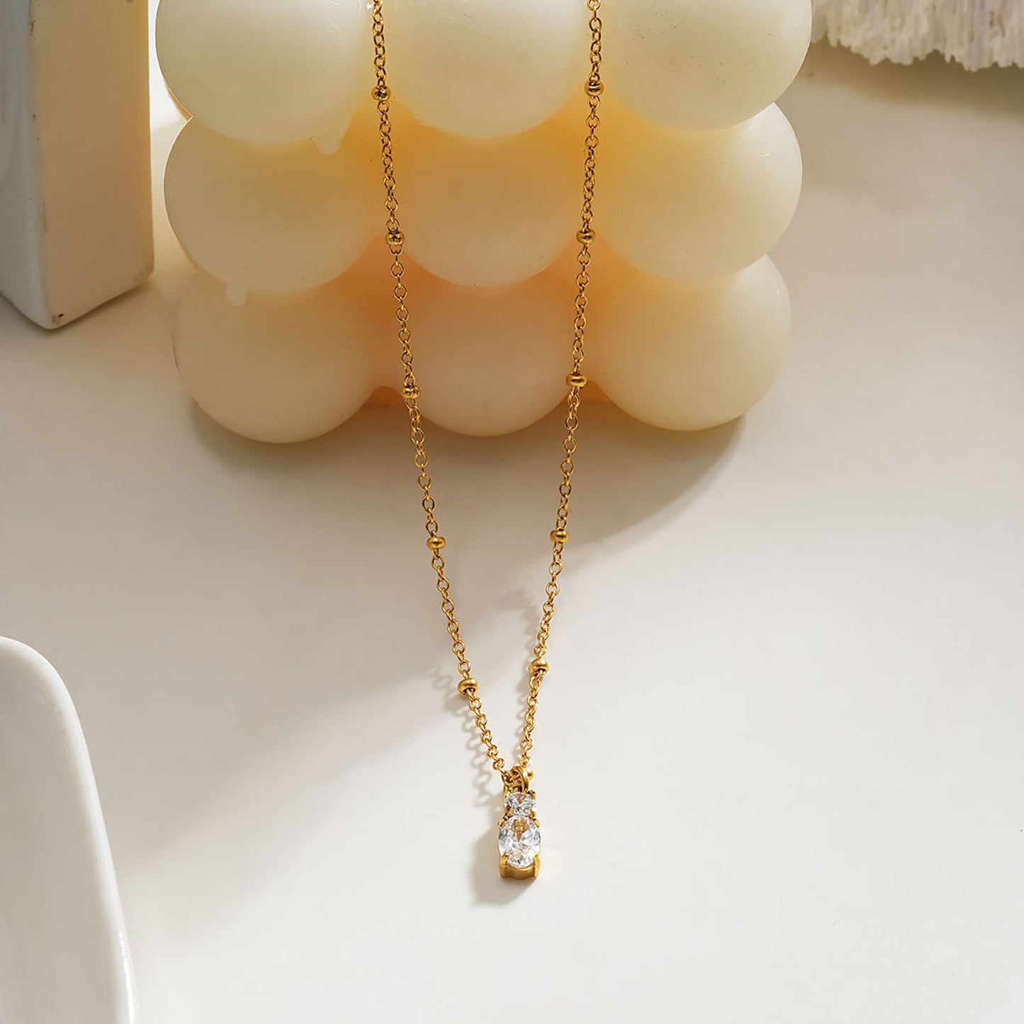 CABBANA Gold: A Duo Set of Zirconia Charm Pendants on a Beaded Chain Necklace