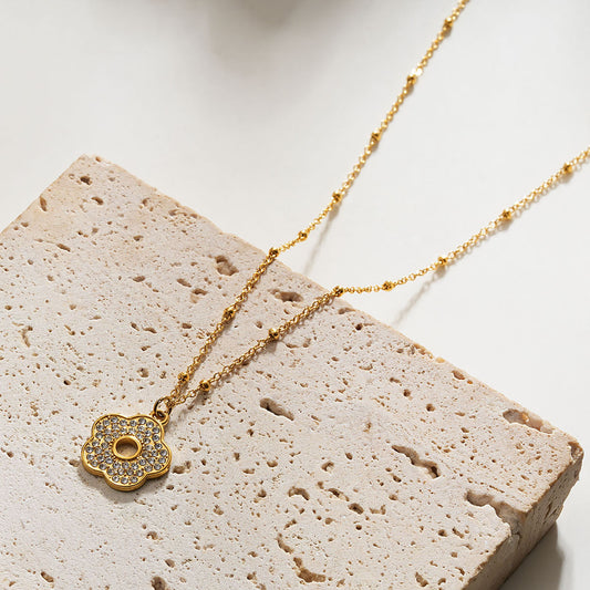 MELRINA Gold Vintage Bloom: Beaded Chain Necklace with Pave Zirconia Flower Charm