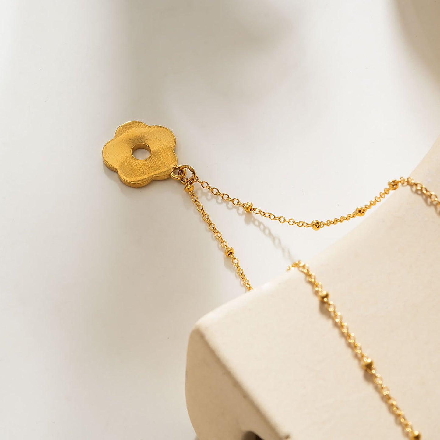 MELRINA Gold Vintage Bloom: Beaded Chain Necklace with Pave Zirconia Flower Charm