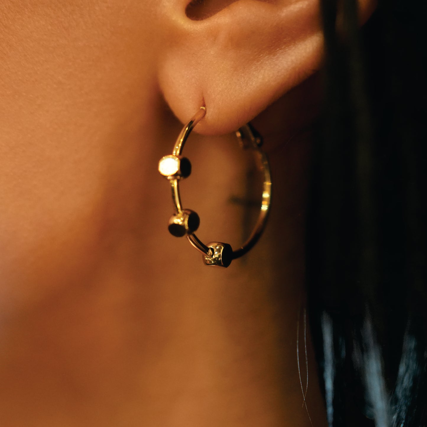 Style MASUYO 1079: Avant-Garde Rounded Hoop Earrings Anchoring a Trio of Square Beads.