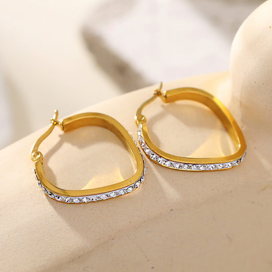 Style MELFI 08565: Rounded Triangle Shaped Hoops embedded with Zirconia Gemstones.