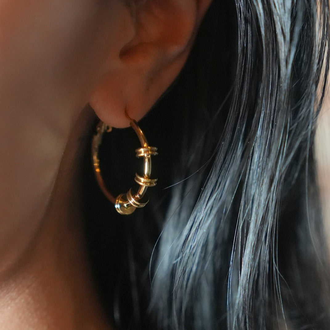 Style MINATO 5336: Modernist Hoop Earrings Anchoring Industrial-Chic Double Discs.