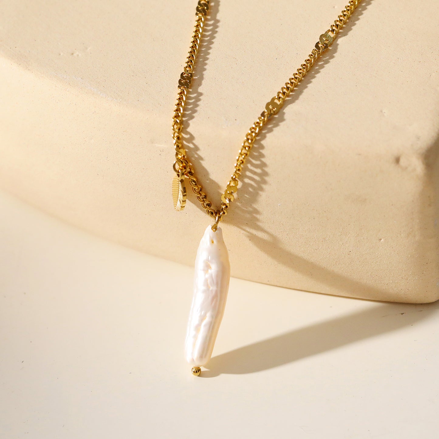 Timeless Baroque Pearl Pendant Necklace with Leaf Charm