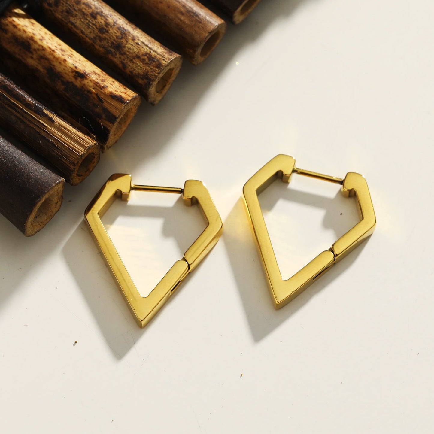 Style: CAGLIARI 1222239 Triangle Shaped Contemporary Hoop Earrings