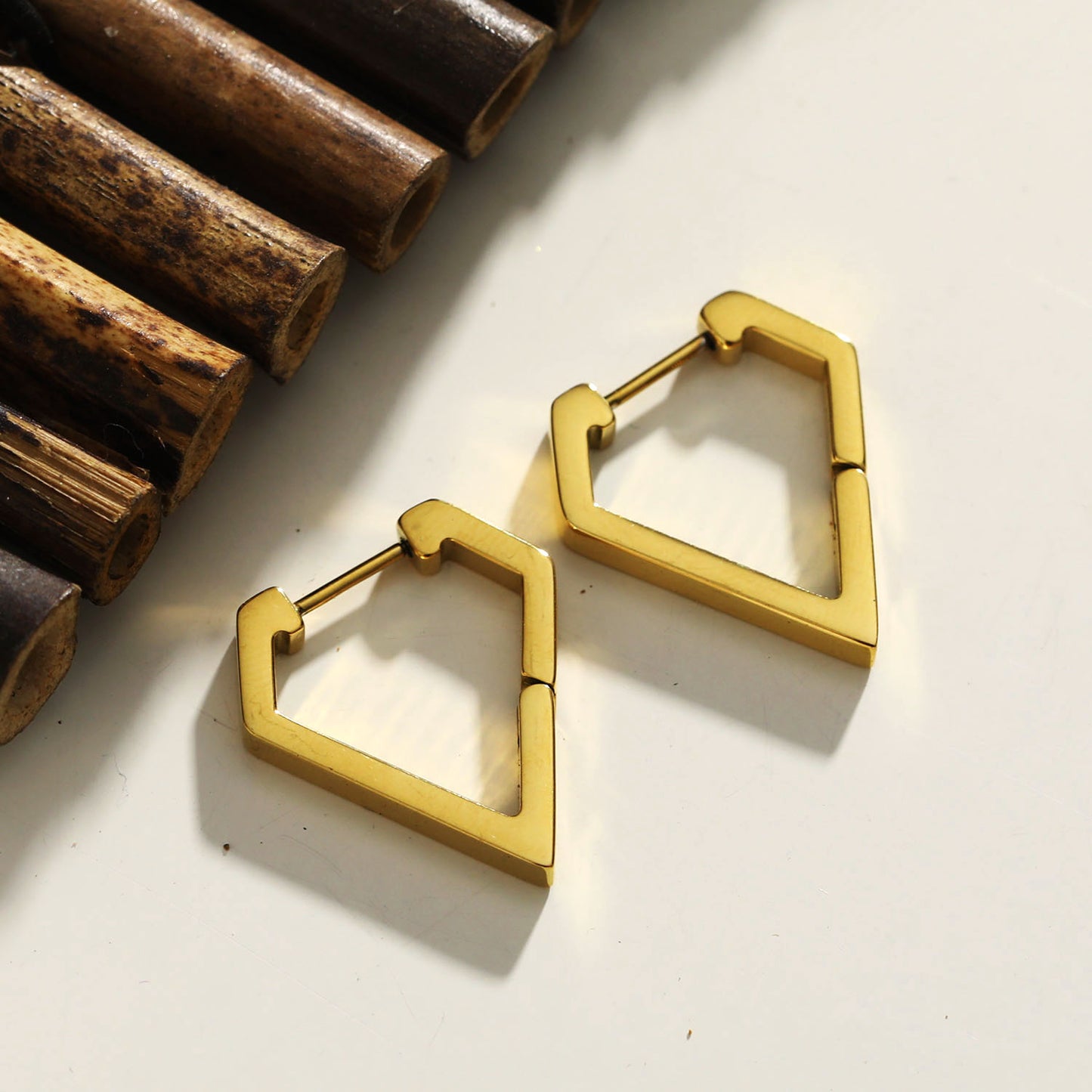 Style: CAGLIARI 1222239 Triangle Shaped Contemporary Hoop Earrings