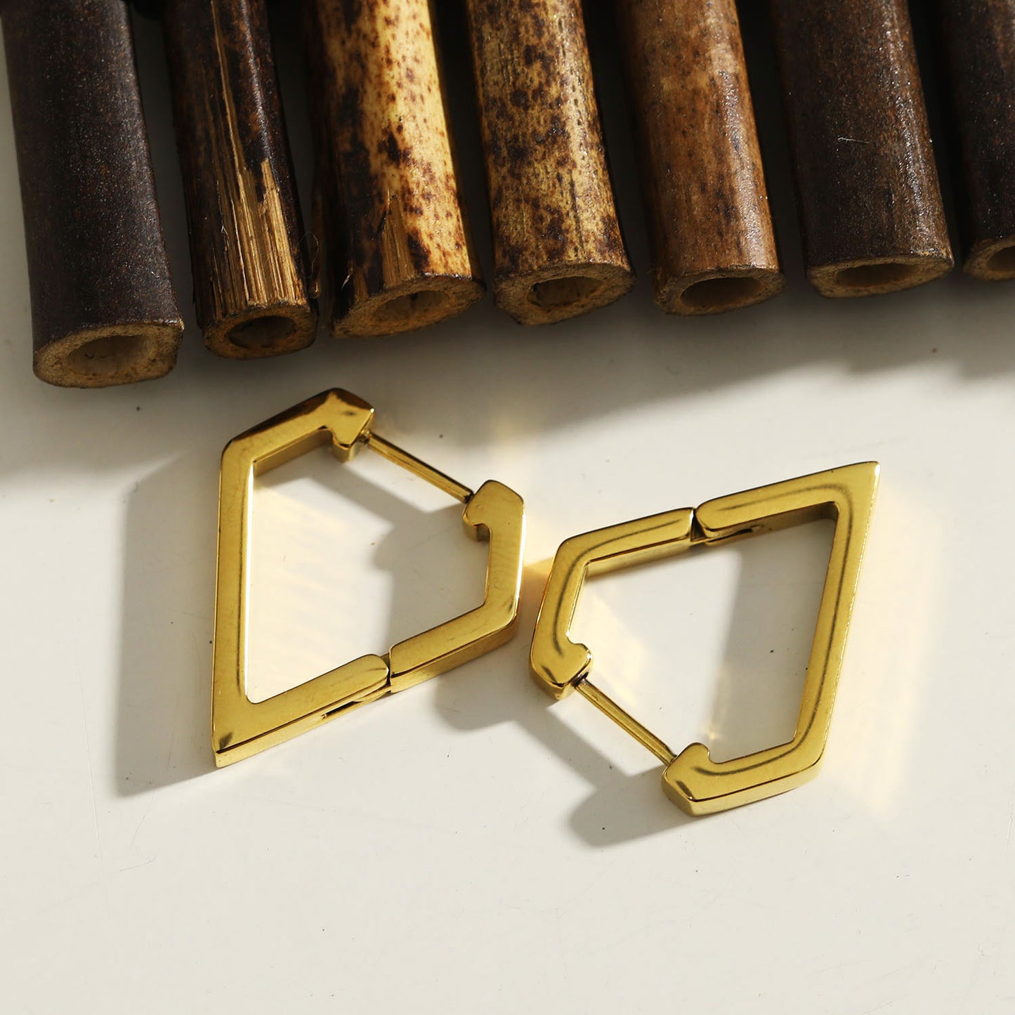 Style: CAGLIARI 1222239 Triangle Shaped Contemporary Hoop Earrings