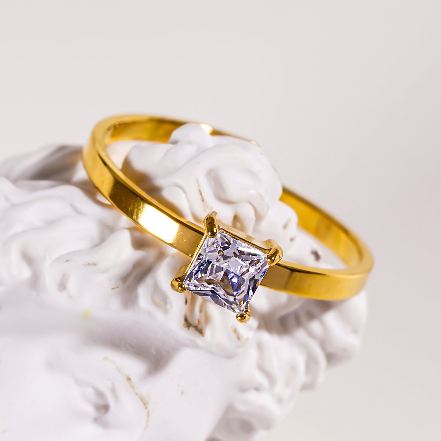 Style ADHIKA 2895: Classic Gold Ring with a Square Zirconia Centerpiece.