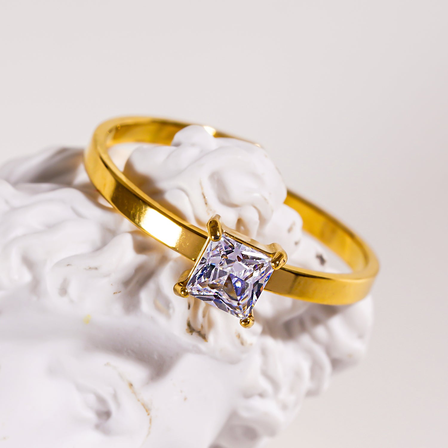 Style ADHIKA 2895: Classic Gold Ring with a Square Zirconia Centerpiece.
