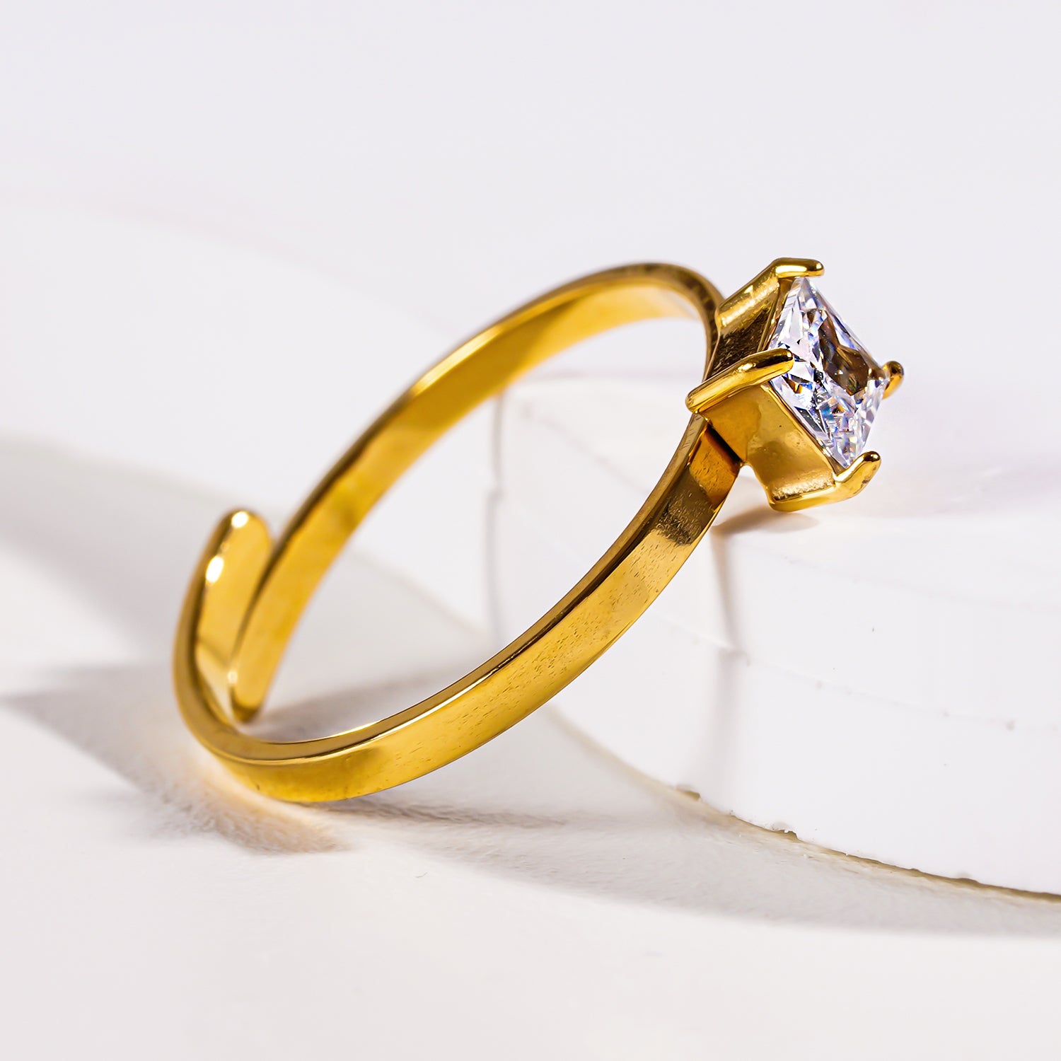 Style ADHIKA 2895: Classic Gold Ring with a Square Zirconia Centerpiece.