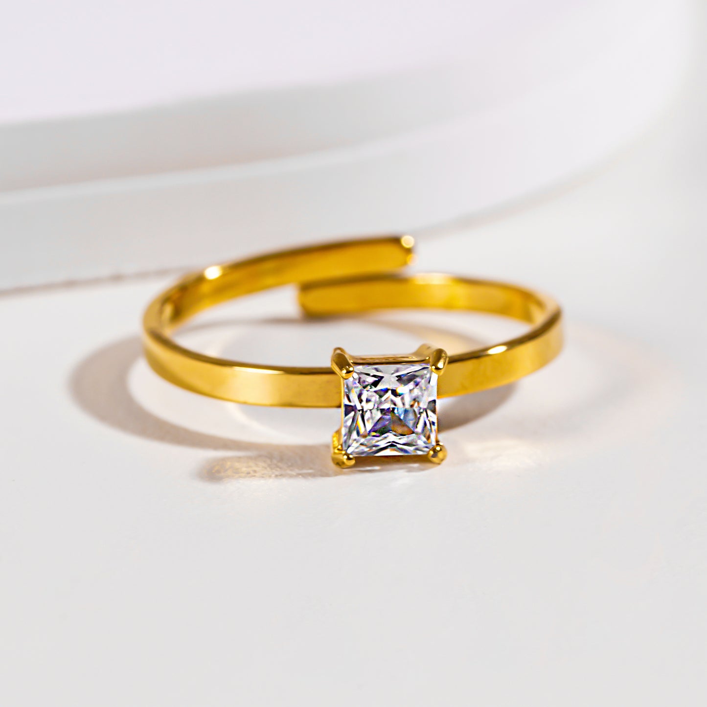 Style ADHIKA 2895: Classic Gold Ring with a Square Zirconia Centerpiece.