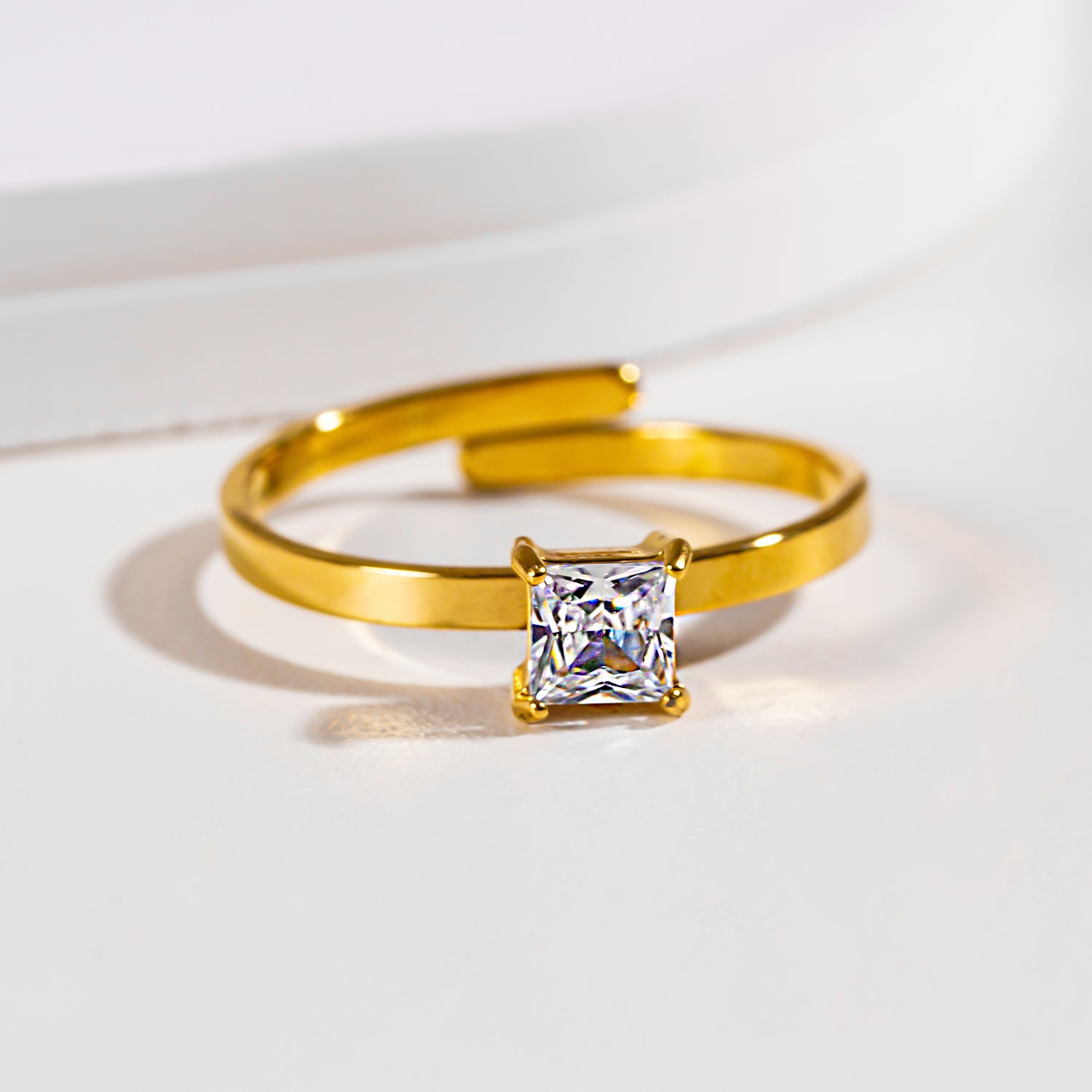Style ADHIKA 2895: Classic Gold Ring with a Square Zirconia Centerpiece.