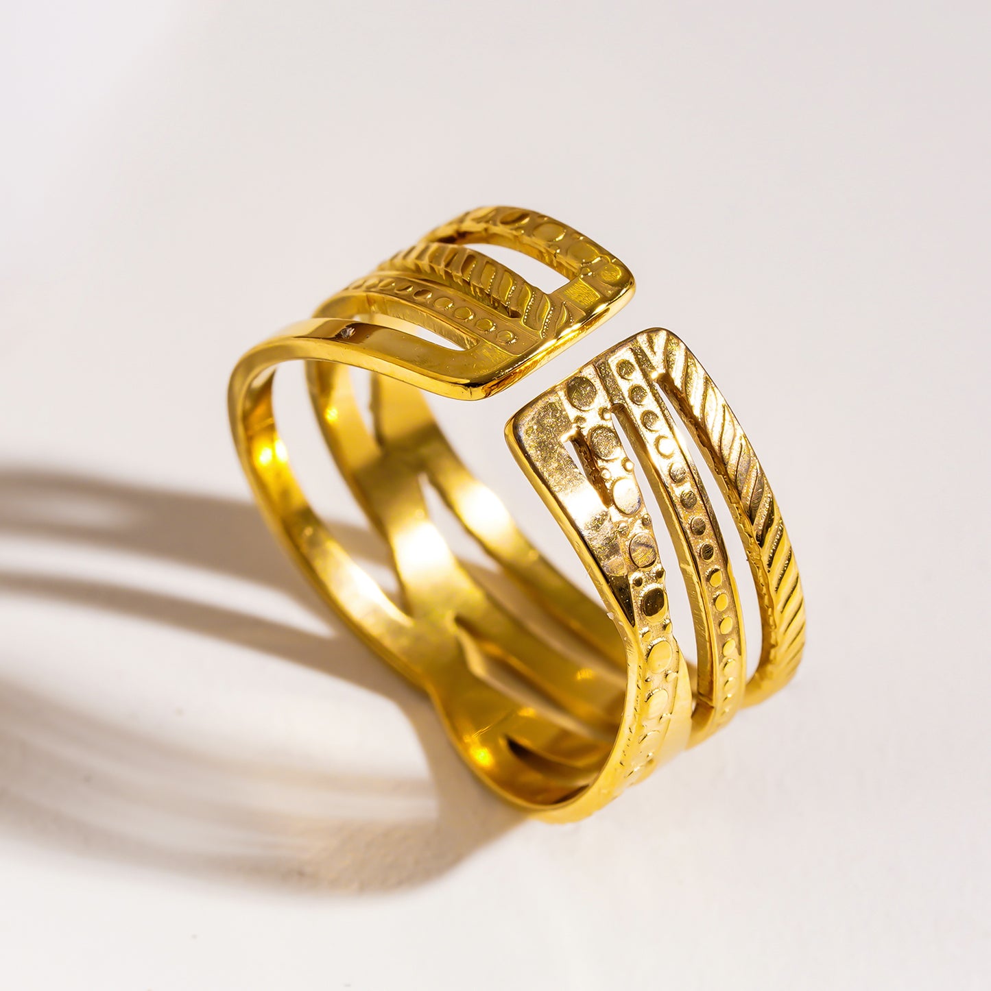 Style ALOIS 7793: Cross Over Multi Stacked Textured Gold Ring.