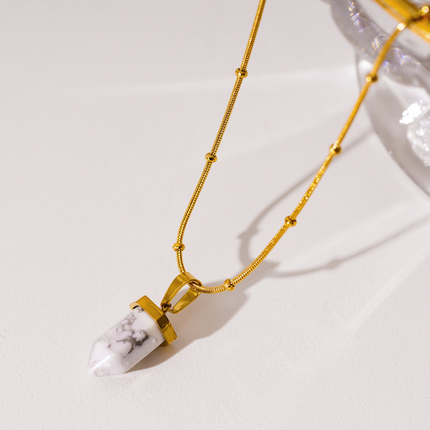 Style AMELIE 2330: White Turquoise Stone Pendant Anchored on a Beaded Snake Skin Textured Chain Necklace.