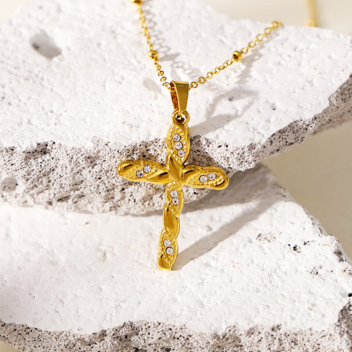 CHAMONIX: Dainty Beaded Chain Necklace with a Zirconia Embedded Textured Cross Pandent