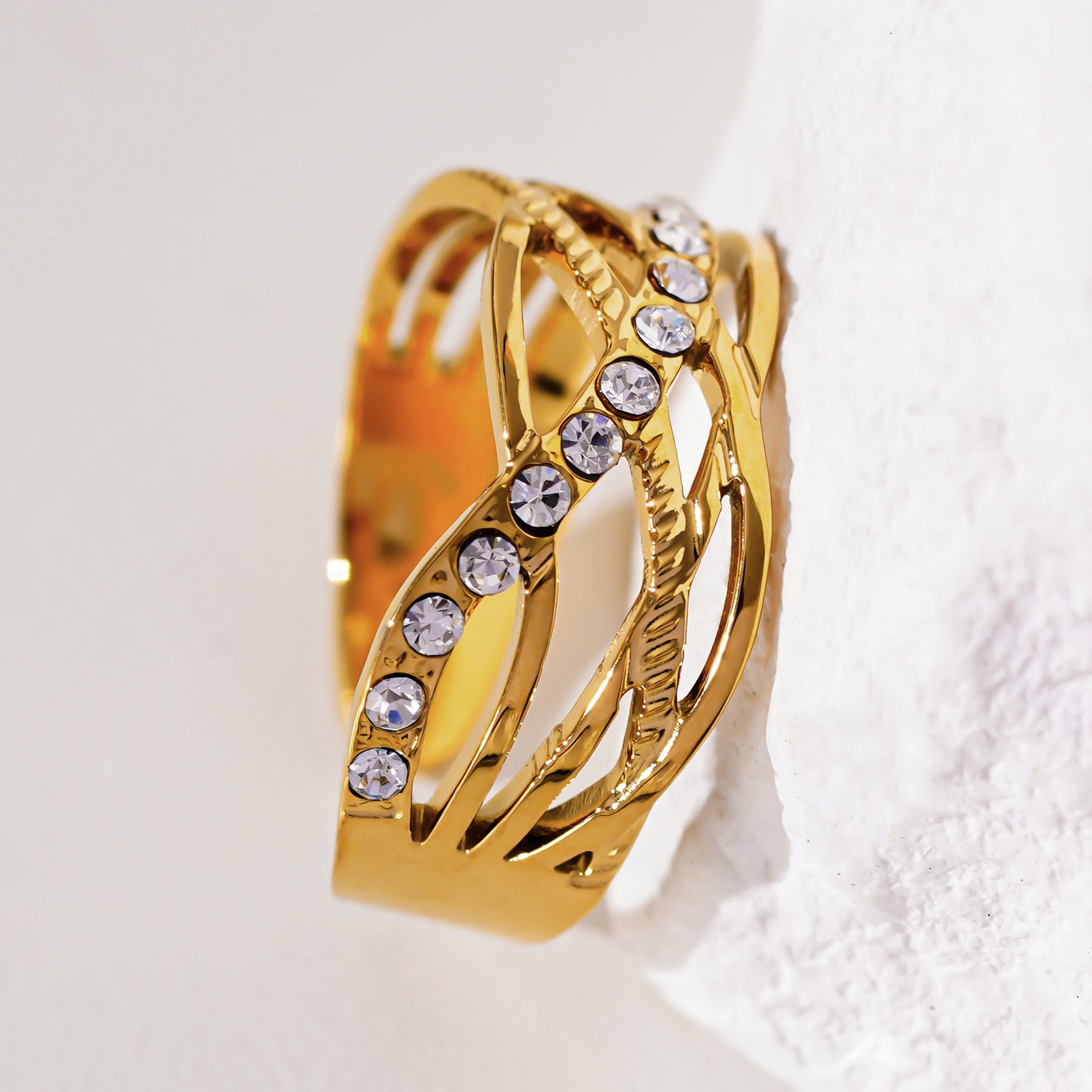 Style CORAZON 0783: Cross Over Multi Stacked Zirconia Embedded Ring.