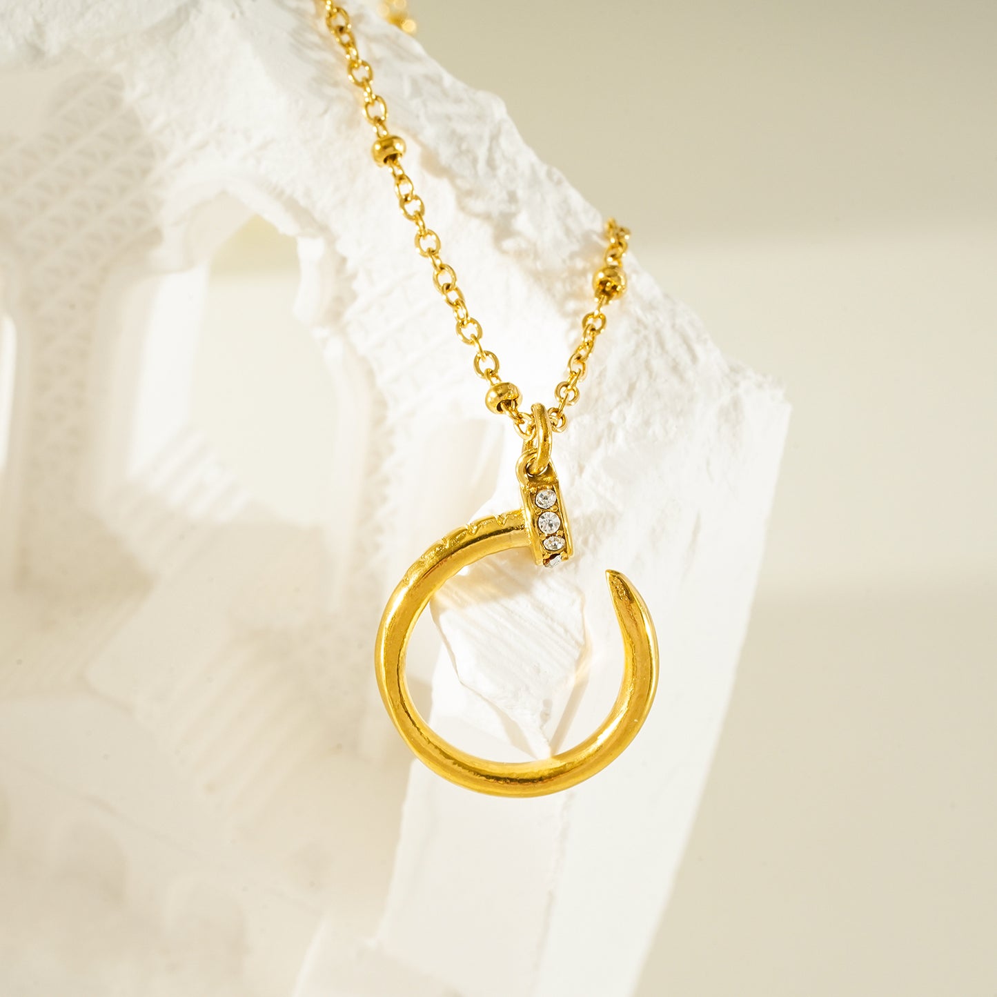 CSENGE Gold Necklace:  Zirconia Embedded Circular Nail Pendant on a Satellite Beaded Chain