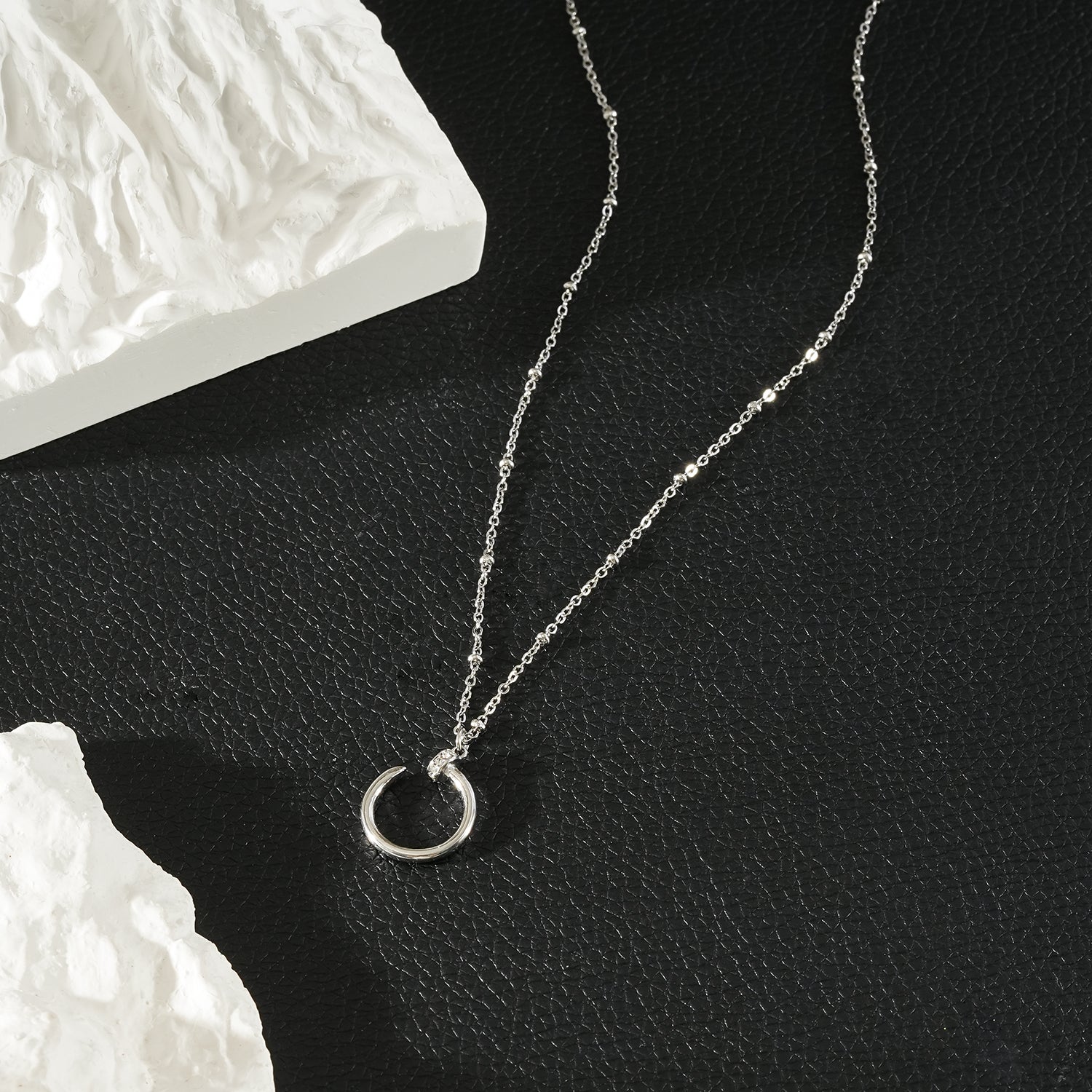 CSENGE Silver (White Gold) Necklace:  Zirconia Embedded Circular Nail Pendant on a Satellite Beaded Chain