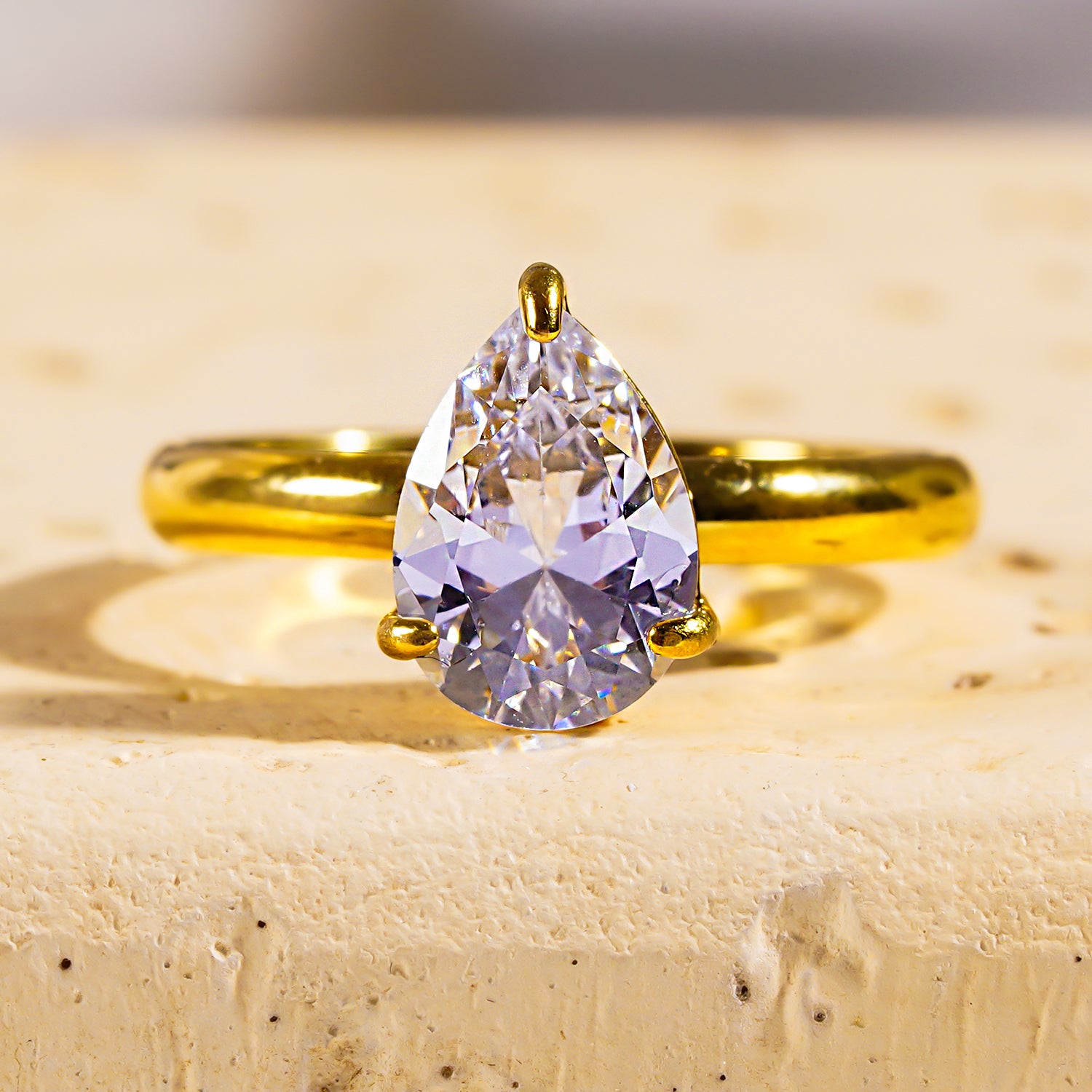 Style DIMONDA 3465: Classic Gold Ring with Prominent Teardrop Zirconia Centerpiece.