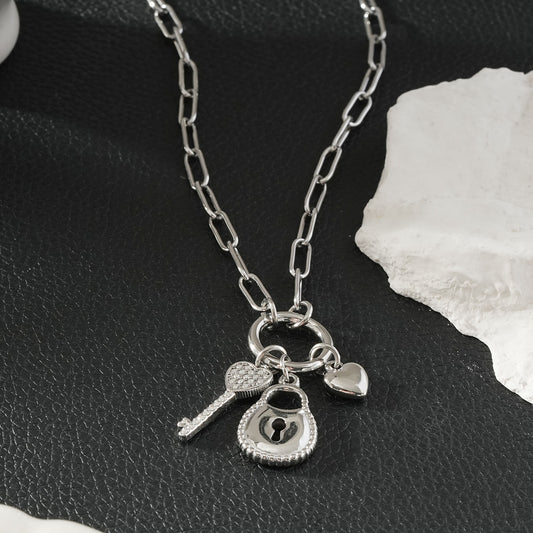 SARDAE Silver (White Gold): Paperclip Chain Necklace with Heart, Key & Padlock Charms $40