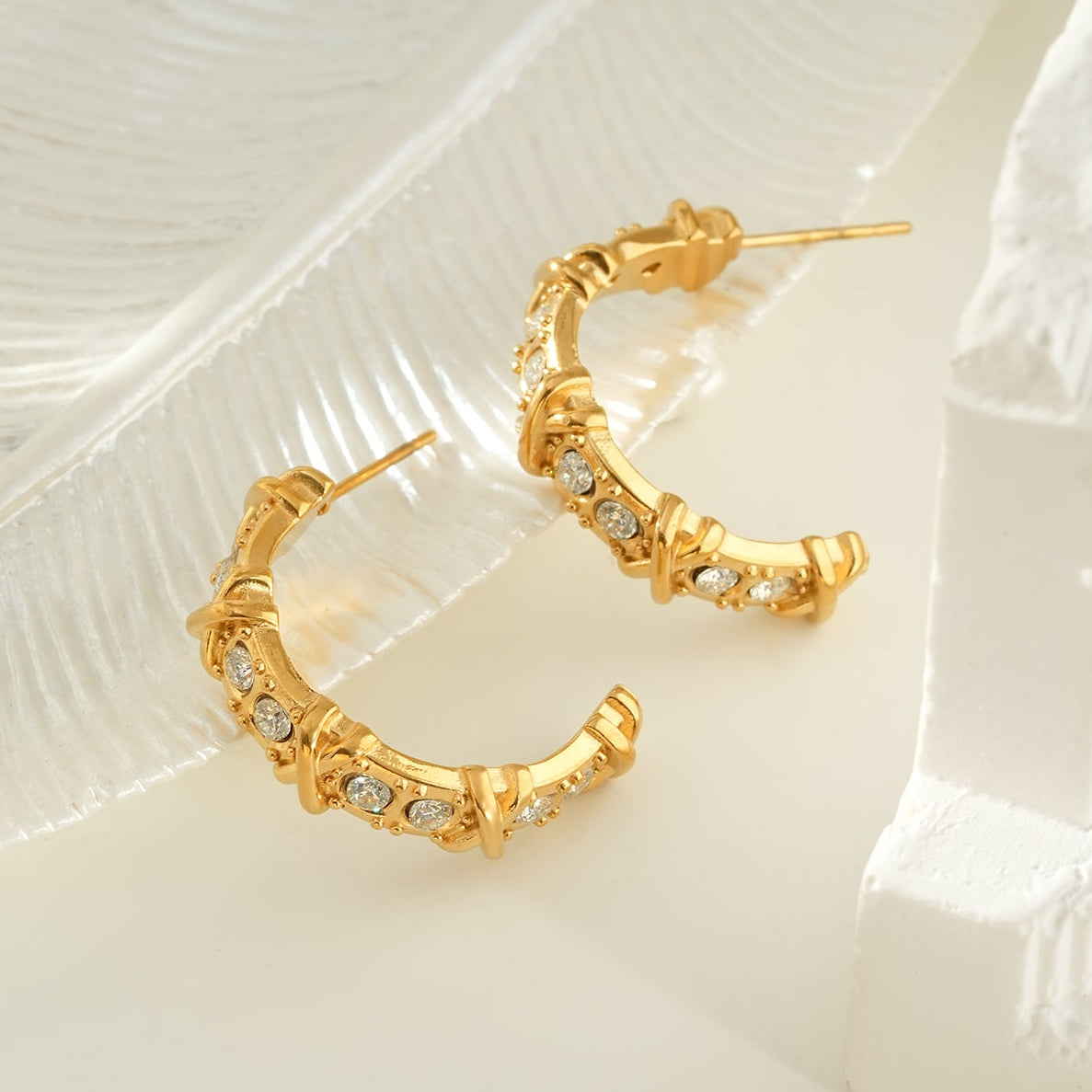 ELICA Gold: Zirconia Embedded Hoop Earrings with Ornate Detail &  Crisscross Accents
