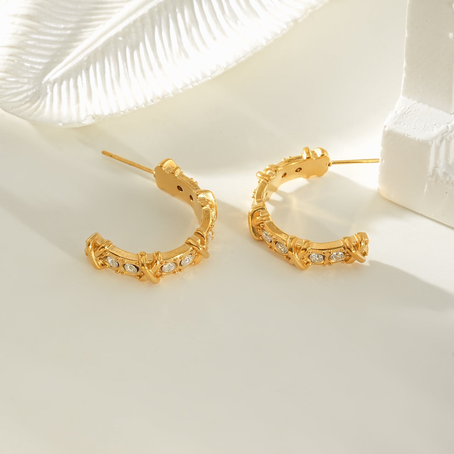 ELICA Gold: Zirconia Embedded Hoop Earrings with Ornate Detail &  Crisscross Accents