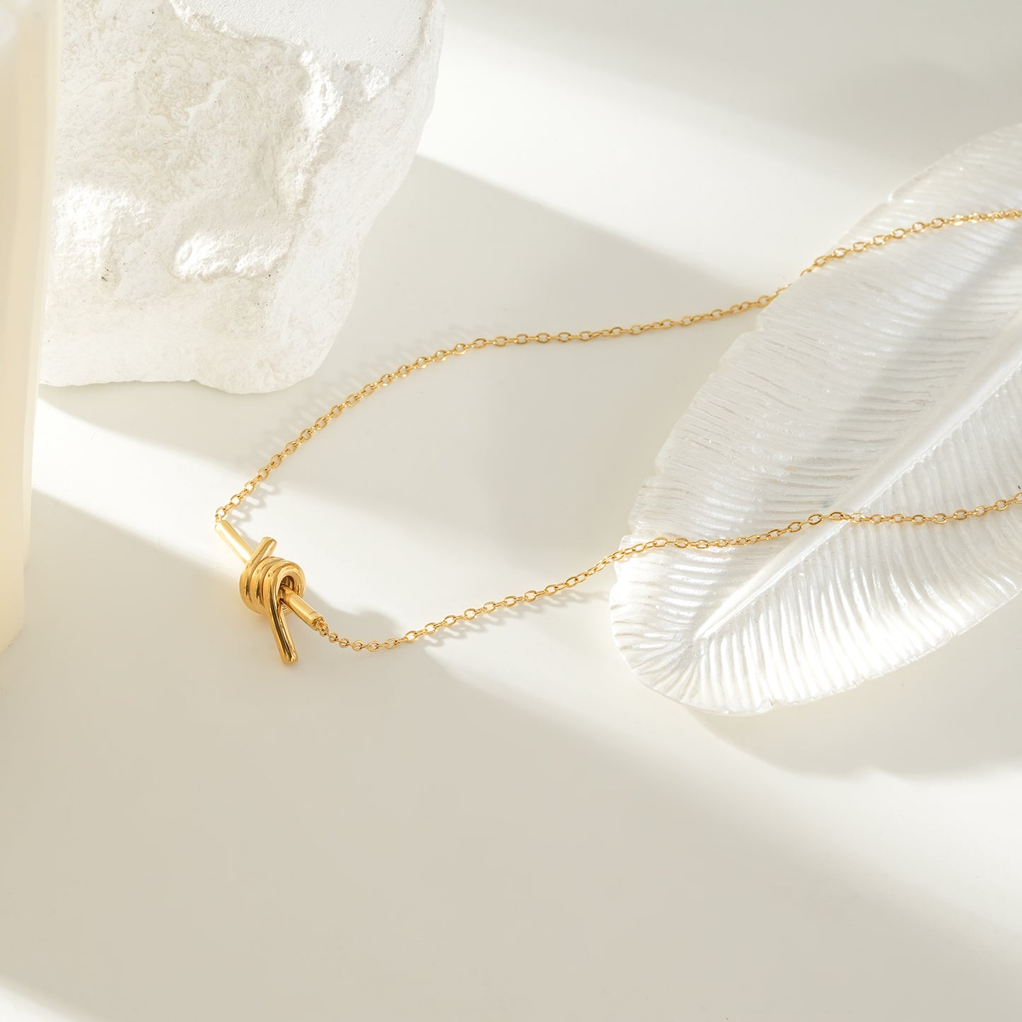 LARISA Gold: Bar Pendant Necklace with Knotted Symbol Detail