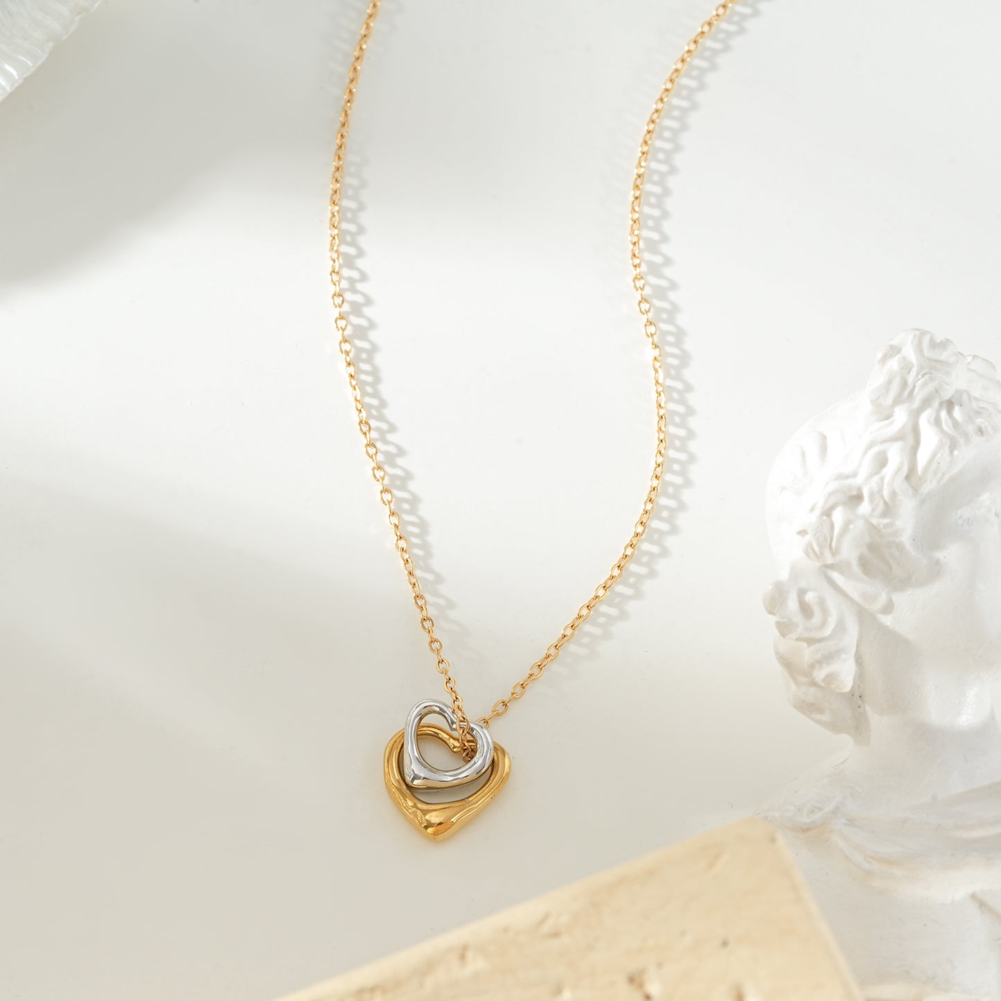 LOLANDA Gold+Silver: Dainty Gold Chain Necklace with Two Abstract Heart Charms in Gold & Silver