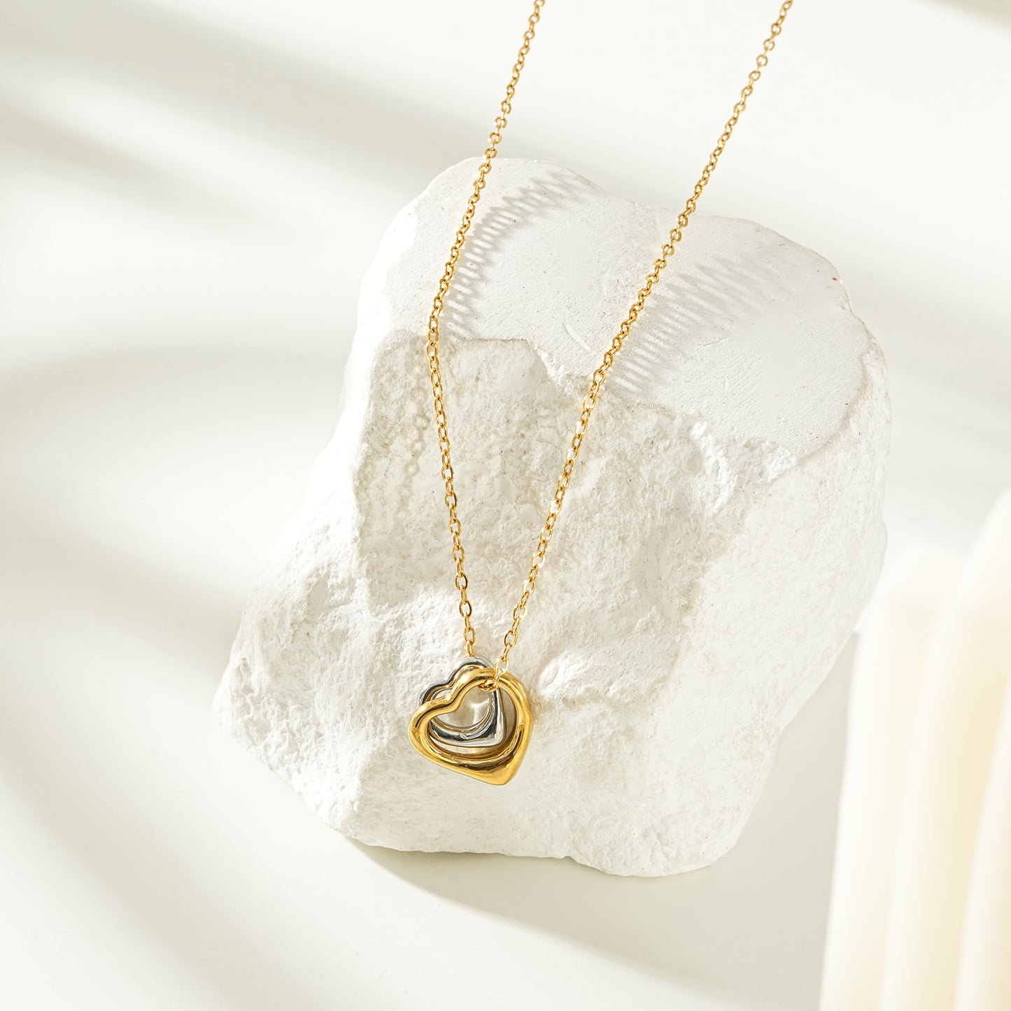 LOLANDA Gold+Silver: Dainty Gold Chain Necklace with Two Abstract Heart Charms in Gold & Silver