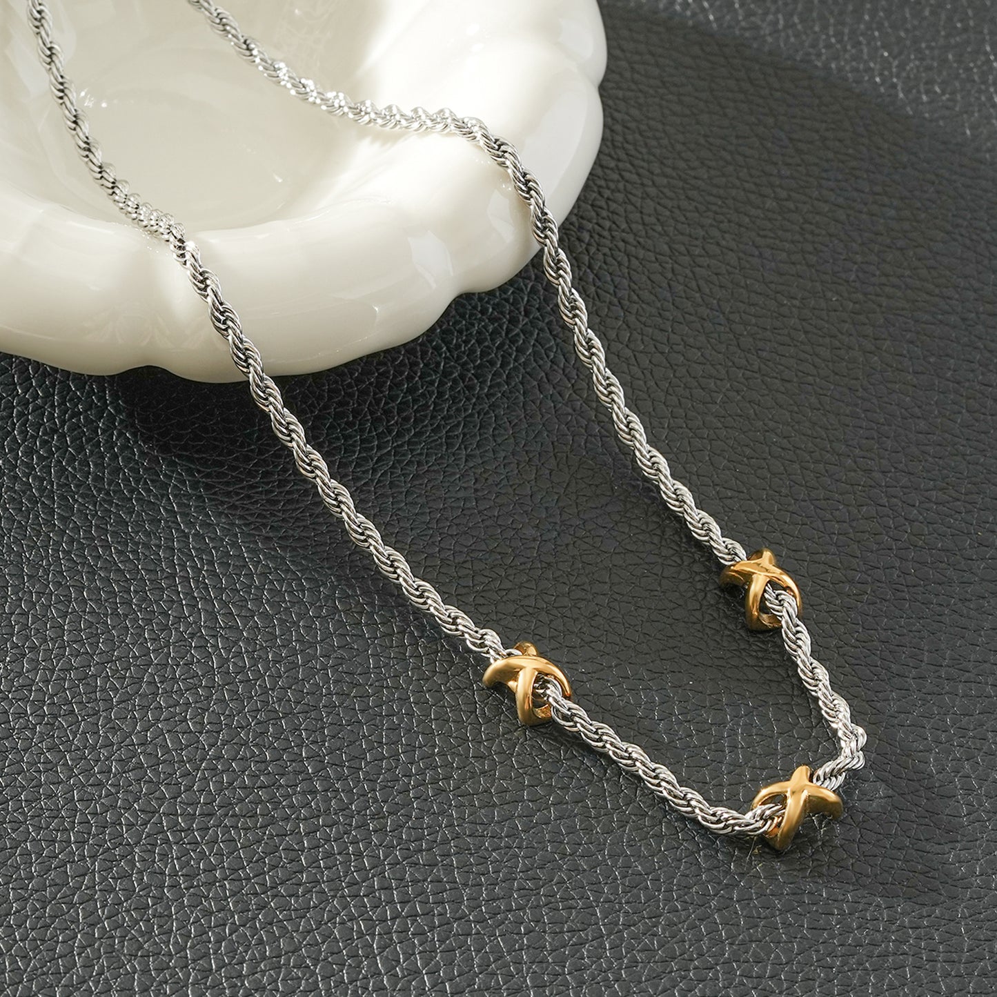 COSMINA Mixed Metals: Silver Rope Chain Necklace with Triple Mini Gold Criss-Cross Charms