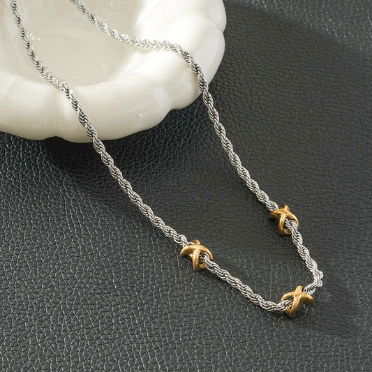 COSMINA Mixed Metals: Silver Rope Chain Necklace with Triple Mini Gold Criss-Cross Charms