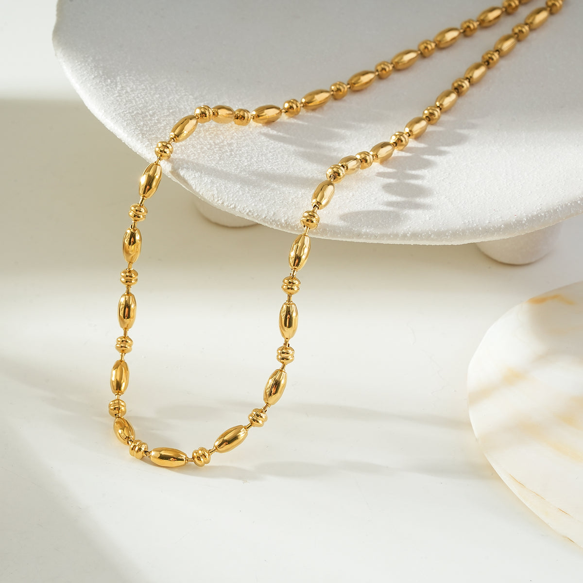 NEEMA Gold: Polished Oval Bead Necklace – Sculpted Statement Jewellery $35