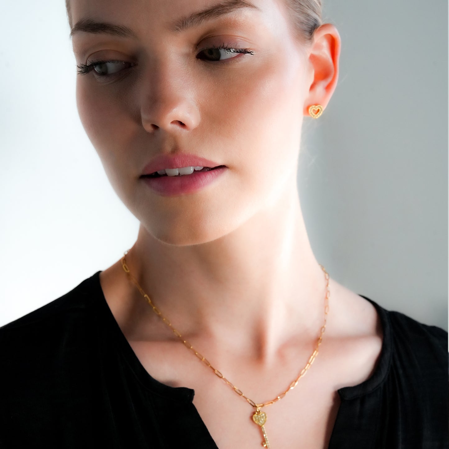 FOREVER Gold: Dazzling Heart Shaped Zirconia (CZ) Embedded Stud Earrings