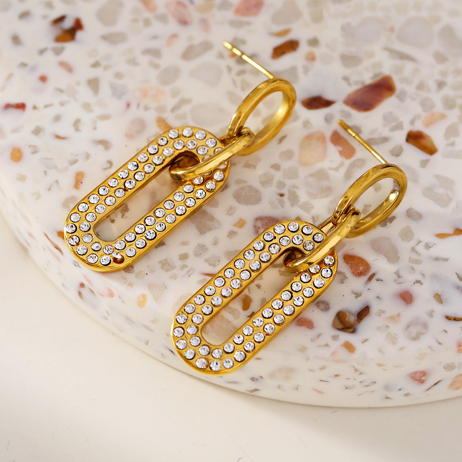 Style LAIA 76857: Rounded Rectangle Shaped Earrings embedded with Zirconia Gemstones.