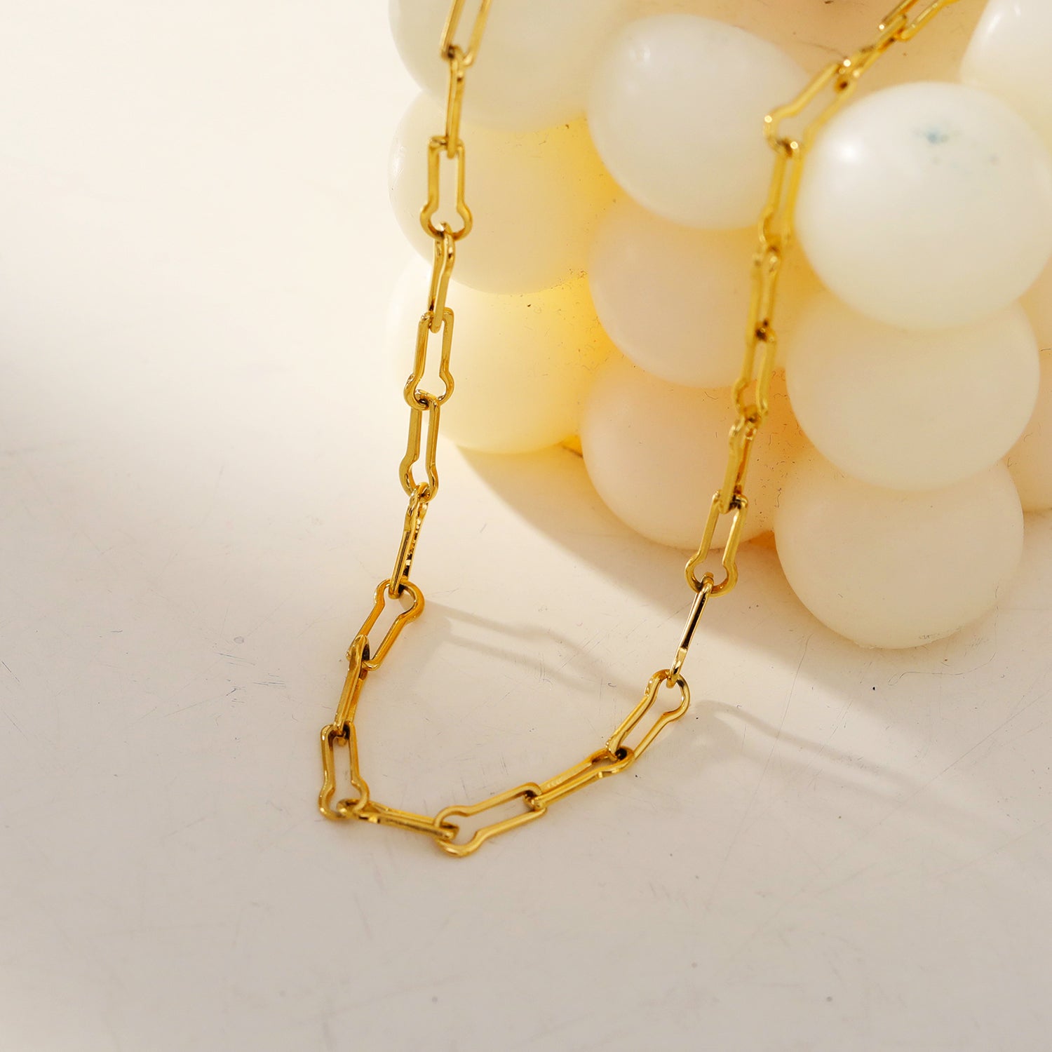 TIASA: Asymmetrical Paper Clip Gold Chain Necklace