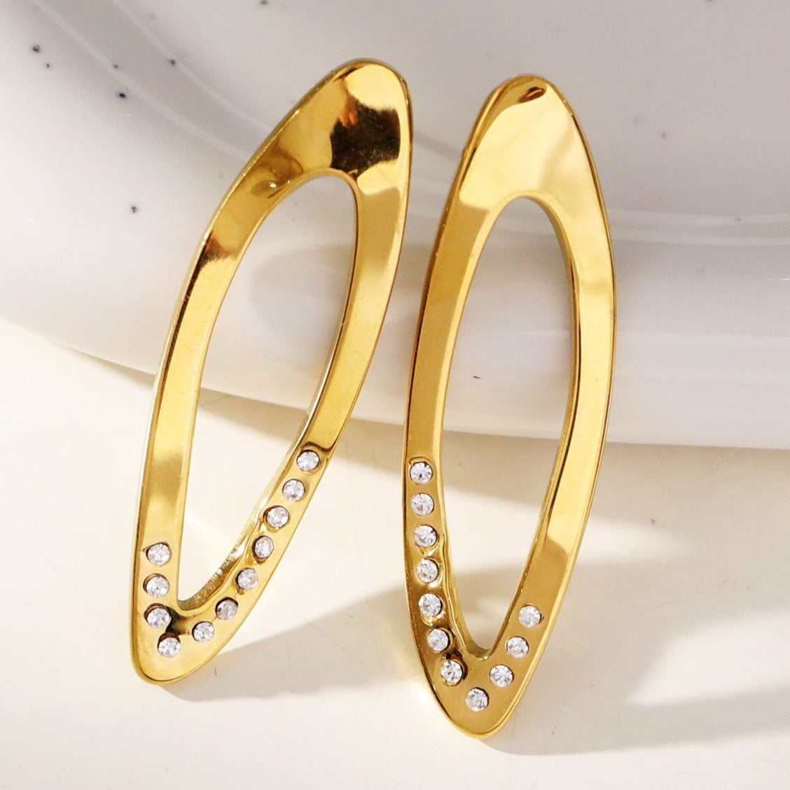 Style: ESSABEL 53285: Zirconia Embedded Sculpted & Twisted Hoop Earrings