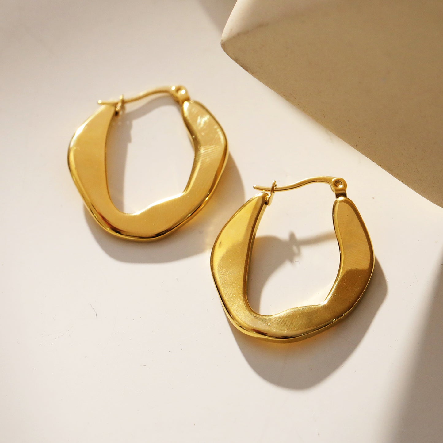 CALIXIA "Sculpted Sophistication: Discover the Allure of Geometric Irregular Hoop Earrings!".