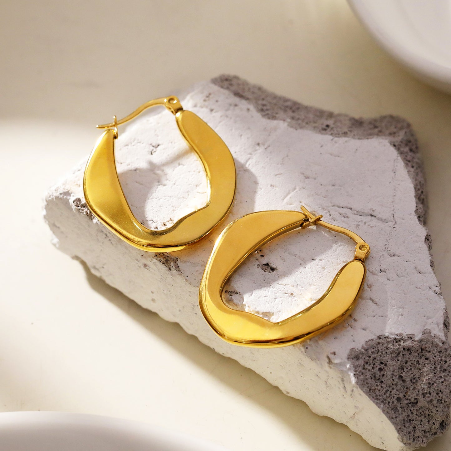 CALIXIA "Sculpted Sophistication: Discover the Allure of Geometric Irregular Hoop Earrings!".