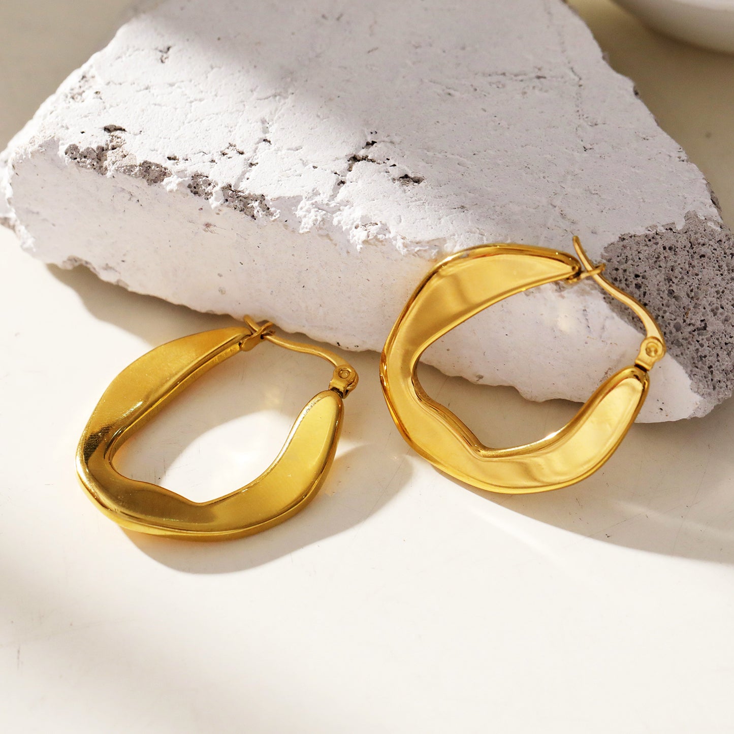 CALIXIA "Sculpted Sophistication: Discover the Allure of Geometric Irregular Hoop Earrings!".