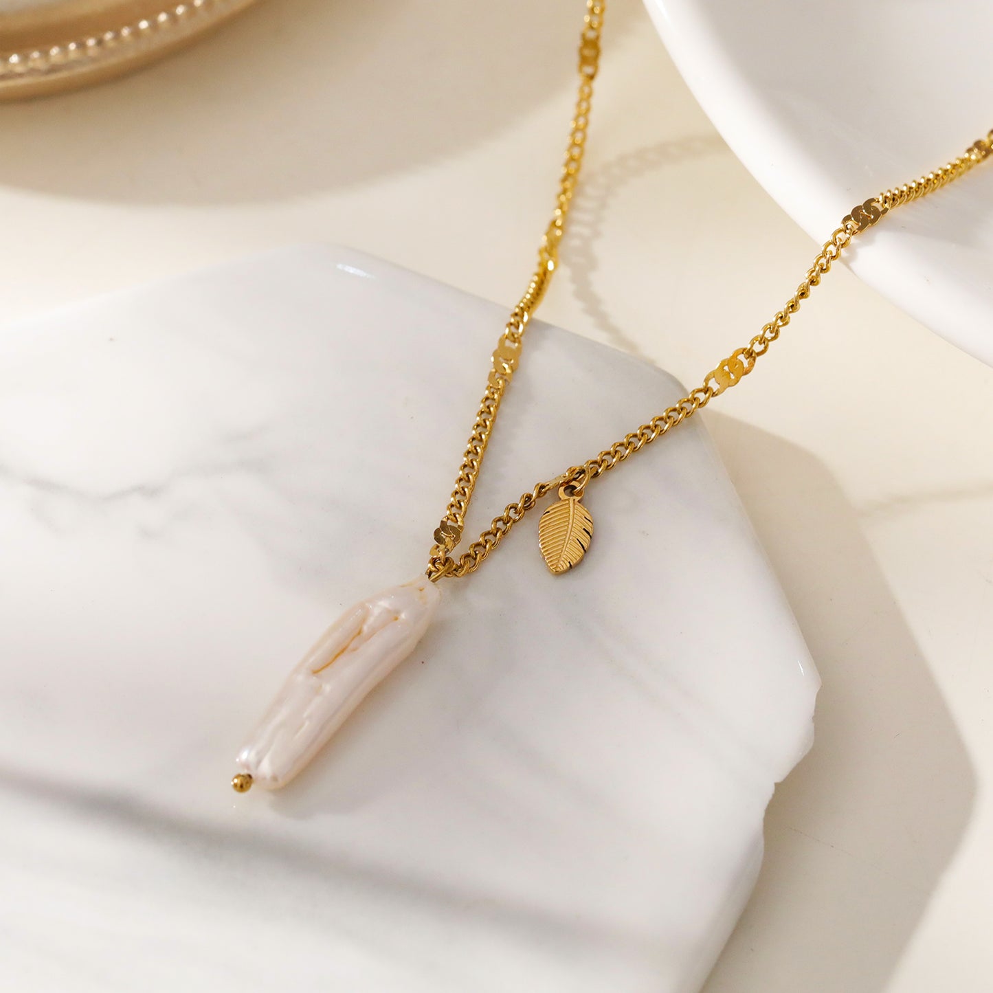 Timeless Baroque Pearl Pendant Necklace with Leaf Charm