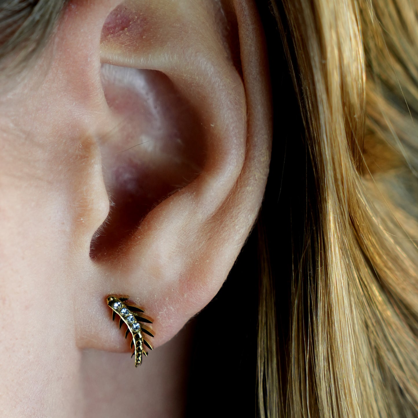 Style: EBBA 122203 'Flying Meteor' Curved Shaped Zirconia Stud Earrings.