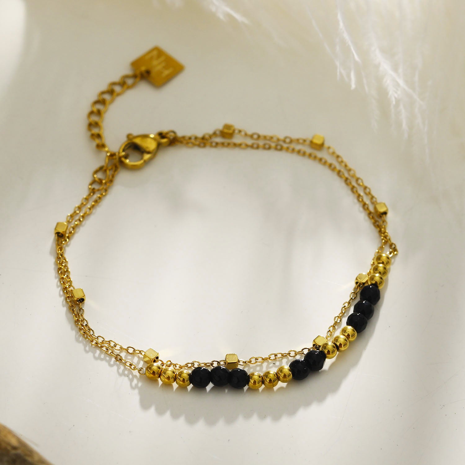 black-gold-bracelet | hackney-nine | hackneynine | necklace | hoops | bracelets | earrings | charms | studs_earrings | jewellery | jewellery-store | shop-jewelry | gold-jewellery | silver-jewellery | dressy_jewellery | classy_ jewellery | on_trend_jewellery | fashion_ jewellery | cool_jewellery | affordable_jewellery | designer_jewellery | vintage_jeweler | gifts-for-her | gifts-for-mum | gifts-for-girls | gifts-for-females