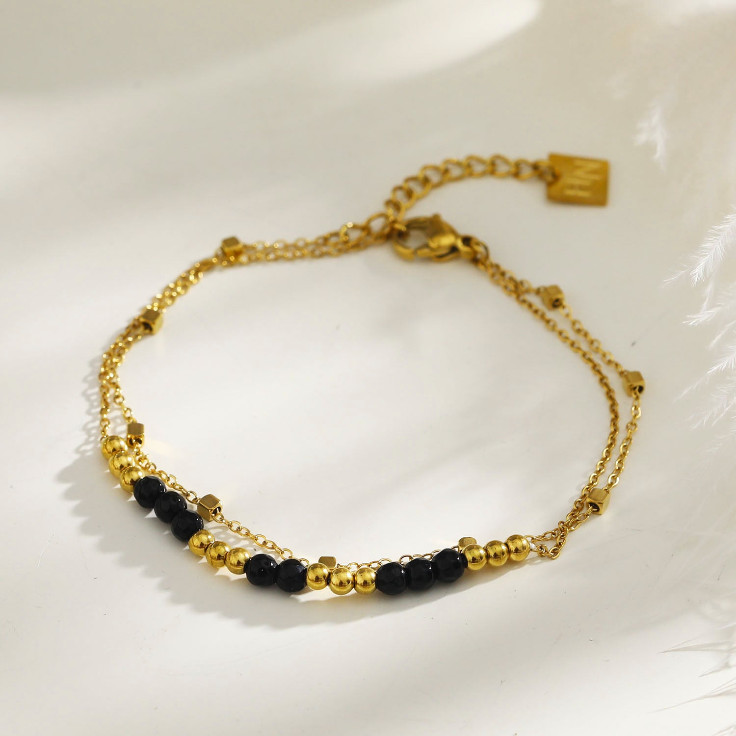 black-gold-bracelet | hackney-nine | hackneynine | necklace | hoops | bracelets | earrings | charms | studs_earrings | jewellery | jewellery-store | shop-jewelry | gold-jewellery | silver-jewellery | dressy_jewellery | classy_ jewellery | on_trend_jewellery | fashion_ jewellery | cool_jewellery | affordable_jewellery | designer_jewellery | vintage_jeweler | gifts-for-her | gifts-for-mum | gifts-for-girls | gifts-for-females