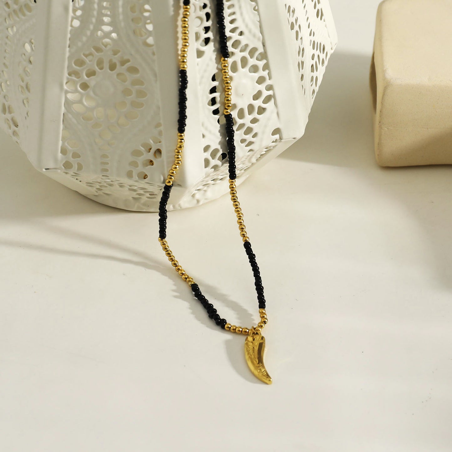 RITA Black & Gold Beaded Chain Necklace with Etched Gold Tooth Pendant