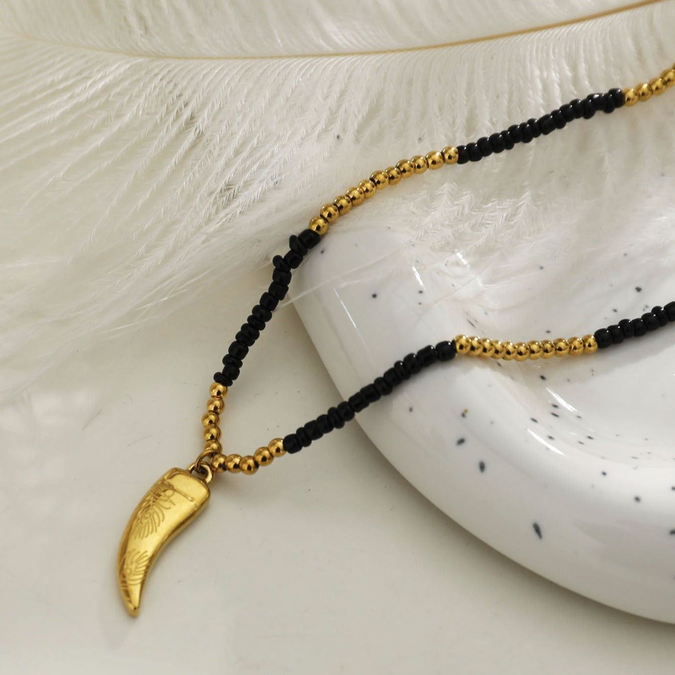 RITA Black & Gold Beaded Chain Necklace with Etched Gold Tooth Pendant