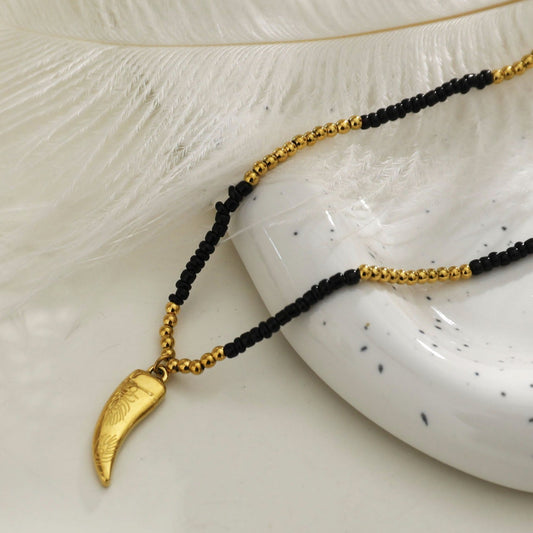 RITA Black & Gold Beaded Chain Necklace with Etched Gold Tooth Pendant