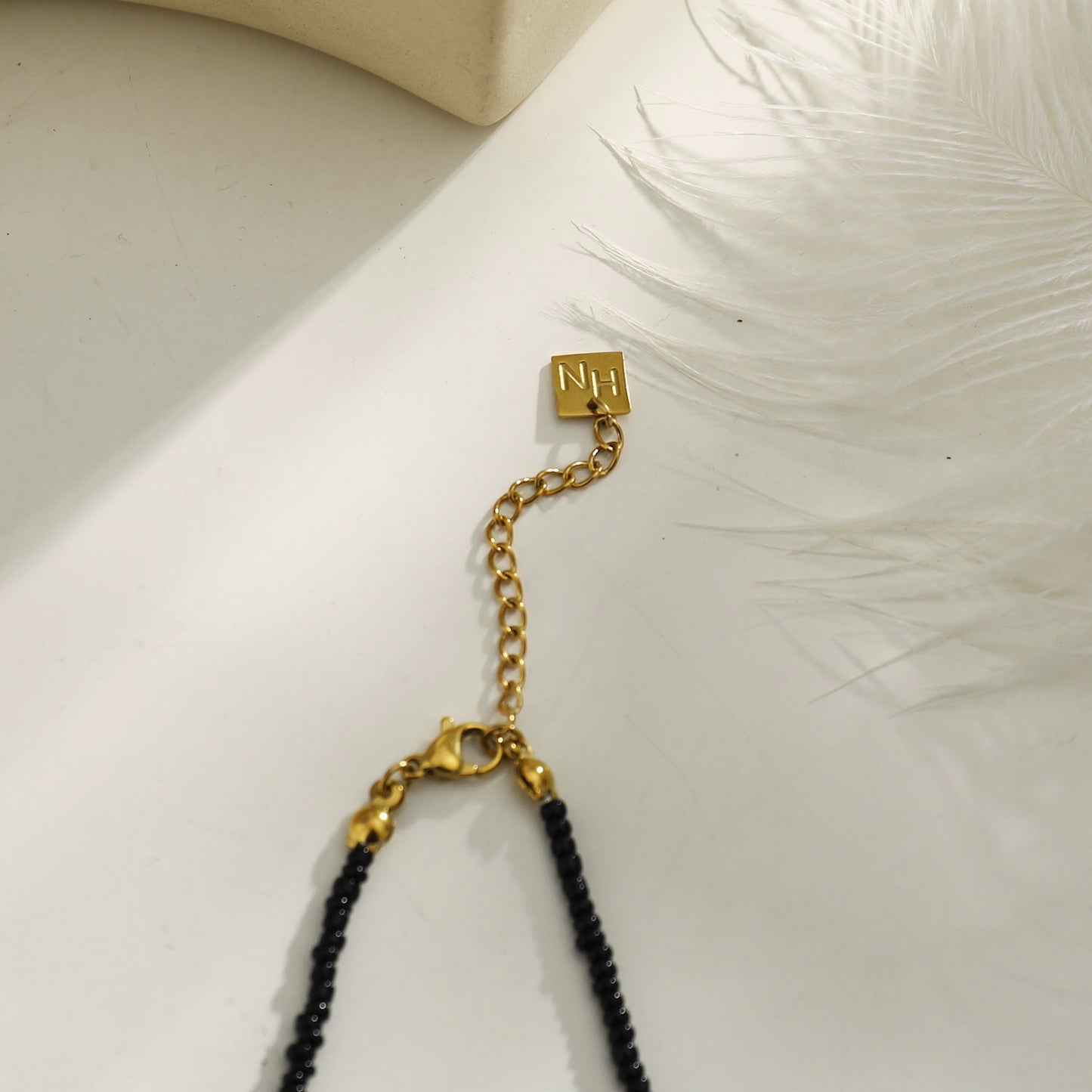 RITA Black & Gold Beaded Chain Necklace with Etched Gold Tooth Pendant