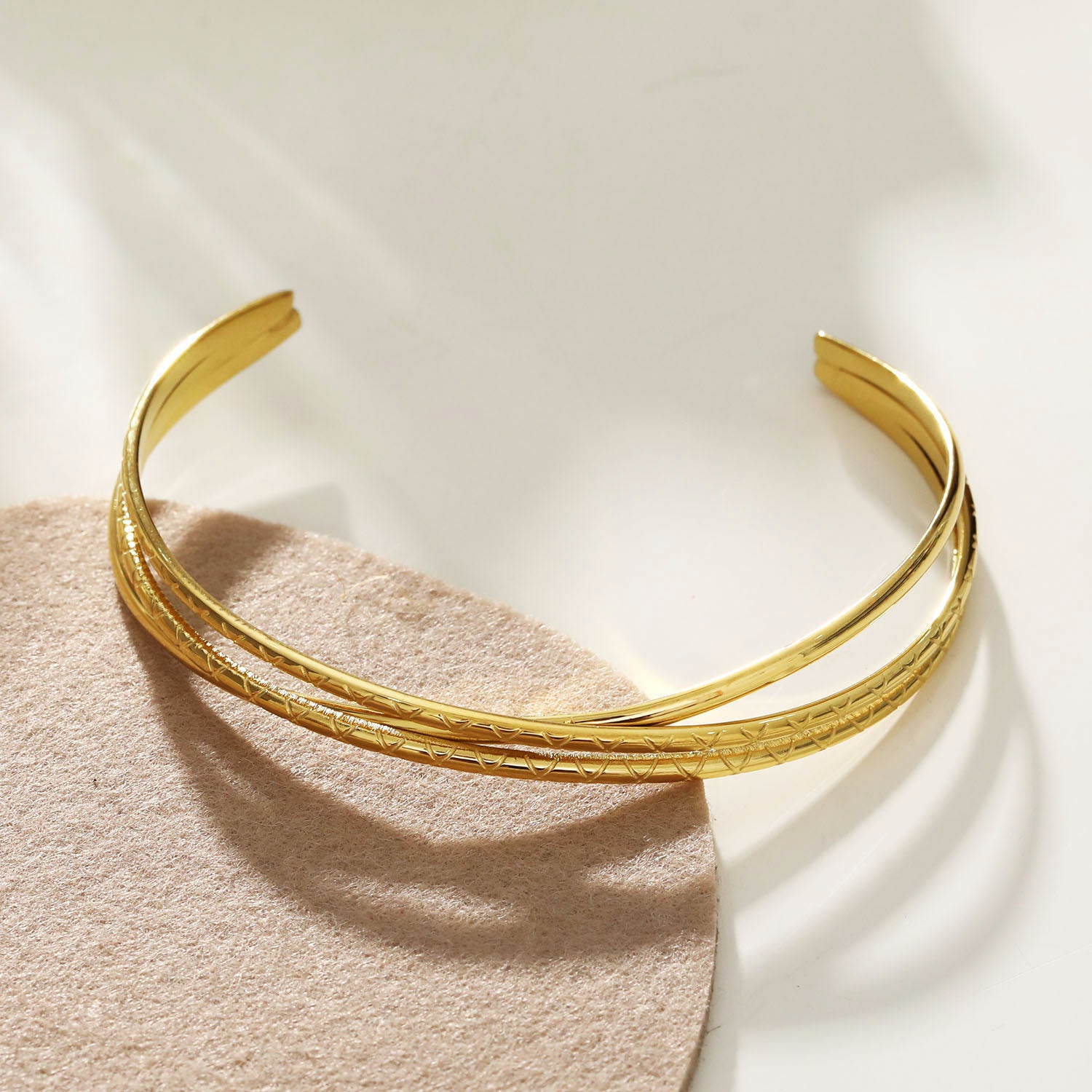 Style: RENIE 221136 Layered Overpass Bracelet with Surface Notch Design.