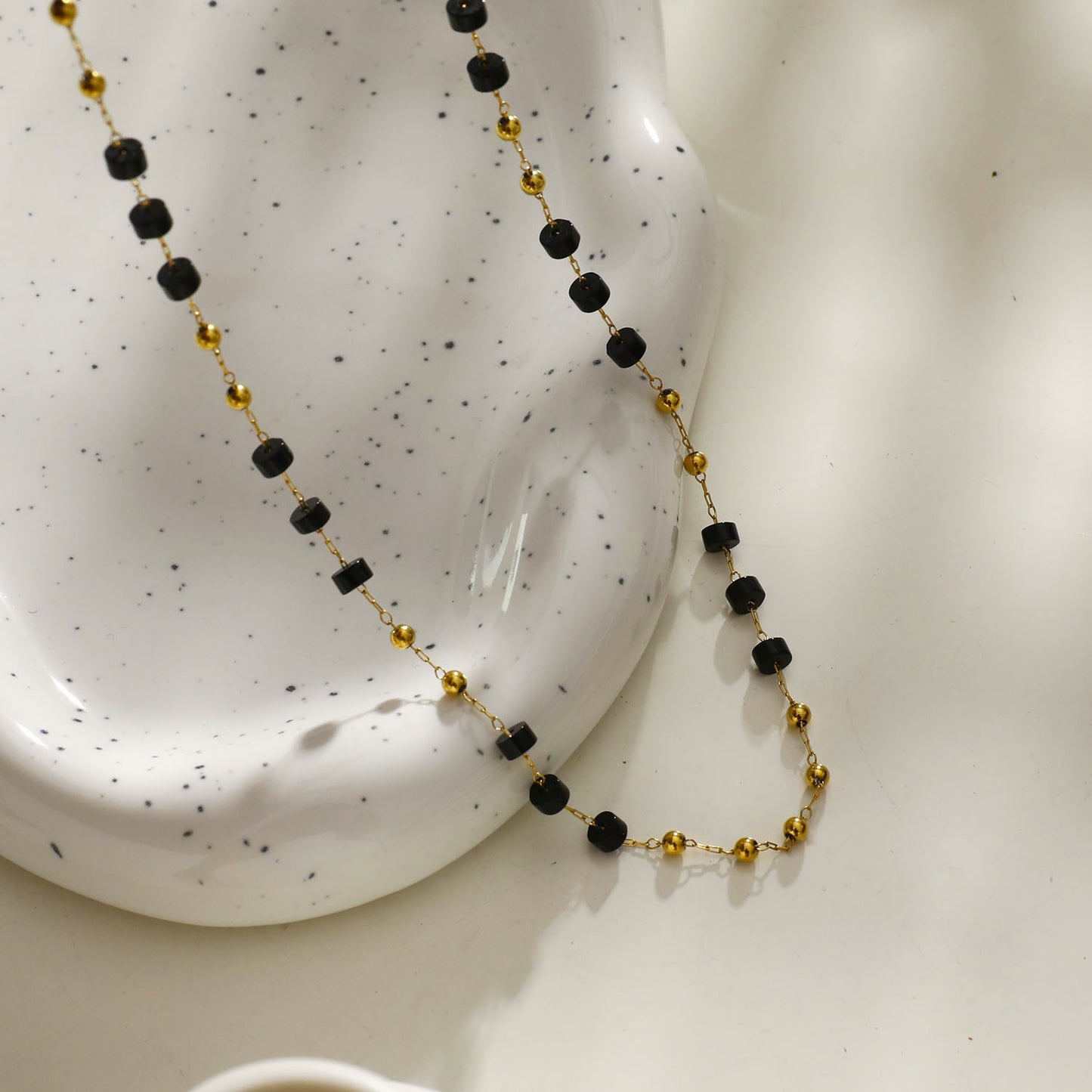 Style: SANTA CRUZ 22107 Black Onyx and Gold Beaded Chain Necklace.